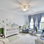 Nursery with custom-painted walls designed by Vernon Caldera, LBRB Design.